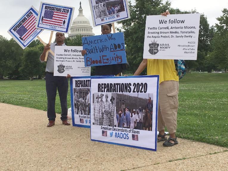 Ados - reparations protest - outside congress - signs