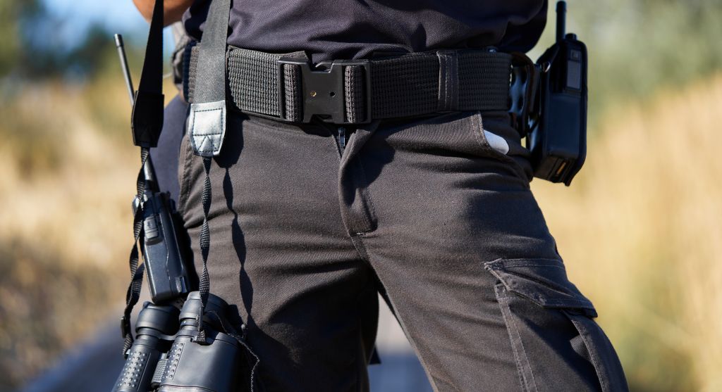 Close-up of lower part of civil protection officer with his work team