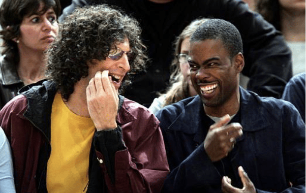 Howard Stern and Chris Rock seated courtside at a New York Knicks game