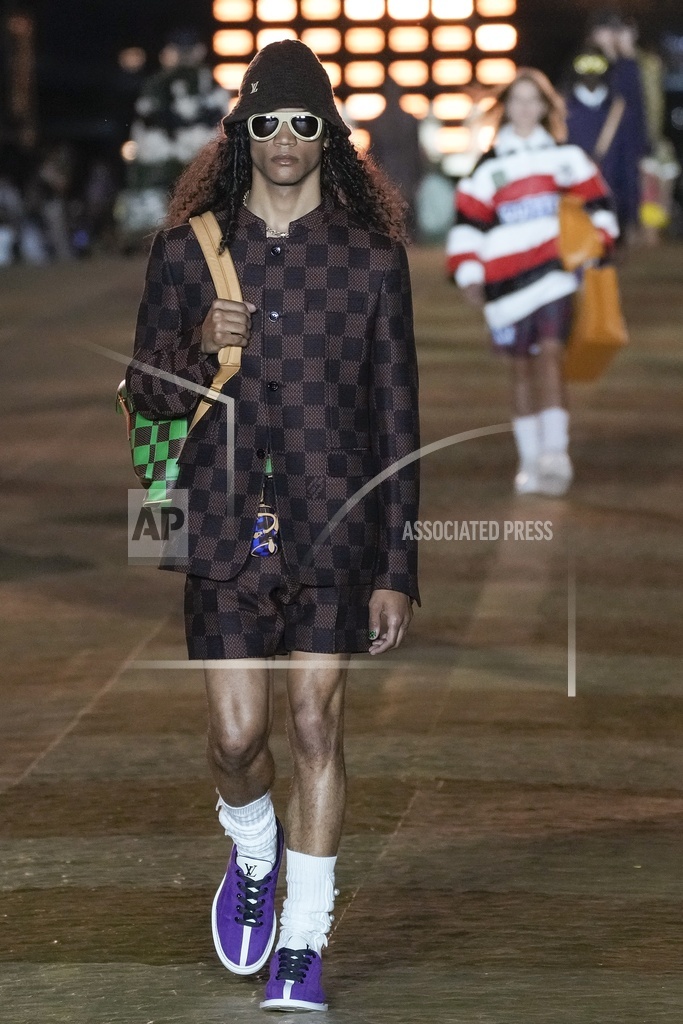 Models wear creations for Louis Vuitton