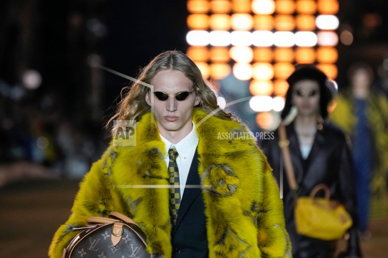 Models wear creations for Louis Vuitton