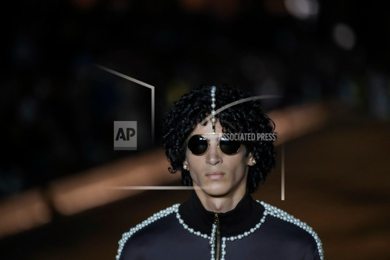 Models wear creations for Louis Vuitton