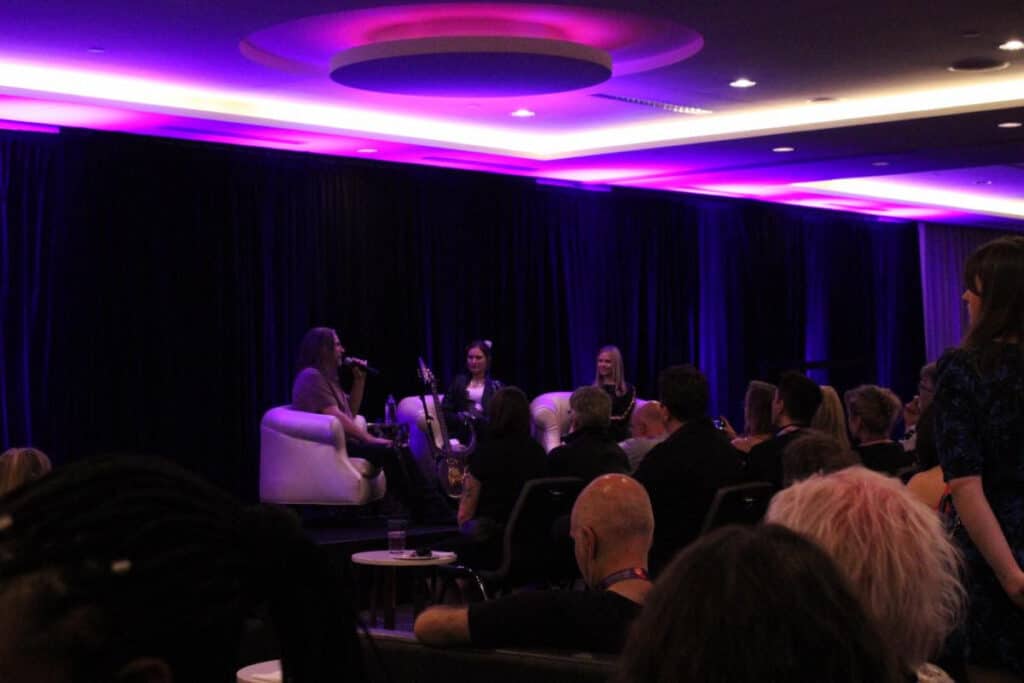 Andy Beech in conversation with Heather Cattnach, Paisley Park Conservationist/Archivist), and Mikayla Elders (Collections Manager)(Photo Courtesy of Paisley Park)