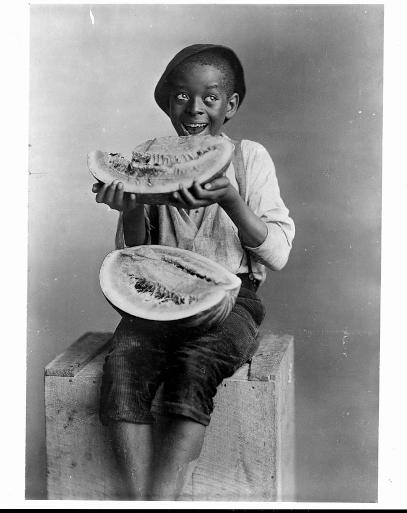 Stereotypical Depiction of African American Boy Eating Watermelon