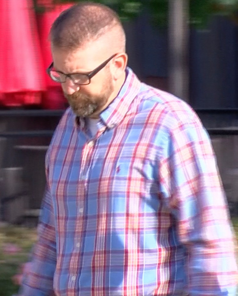 Jeffrey Middleton, a former sheriff's deputy in Rankin County, Miss., walks into the federal courthouse in Jackson, Miss.