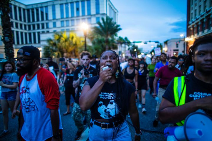 Protestors rally in honor of the victims.