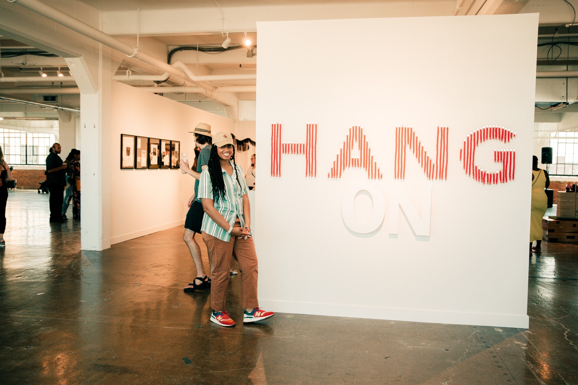 Artist Ayanna Tibbs in front of her work “Even if…It’s by Threads, 2023” // Photo: GABRIELLE_MINION
 