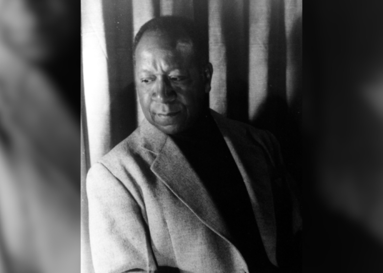 Portrait of Beauford Delaney seated.