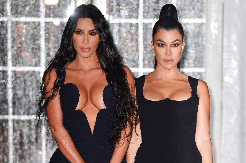 Kim and Kourtney Kardashian - Getty