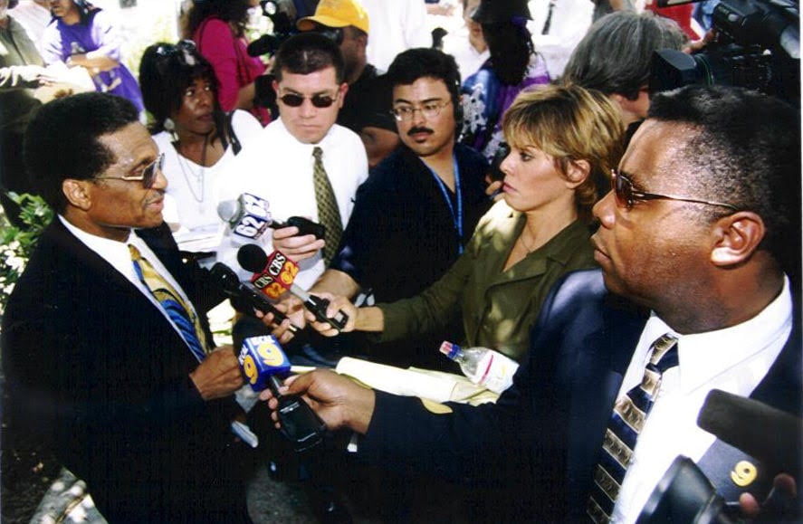 Joe C. Hopkins at a press conference, taking questions from reporters after a police abuse case in Inglewood, CA.