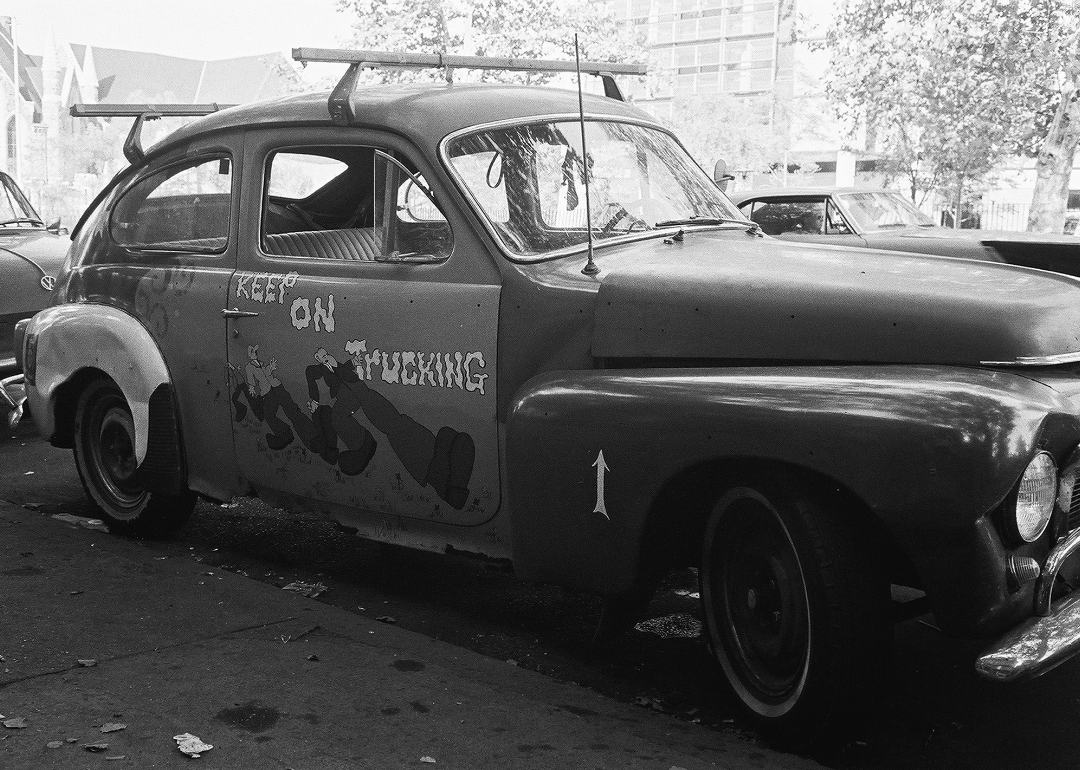 Car painted with 'Keep On Truckin’' in the style of Robert Crumb.