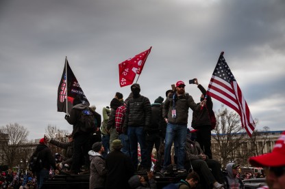 Jarring images from the January 6th insurrection in 2021. Image: Jon Cherry/Getty Images.