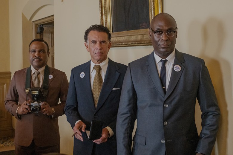 In the film “Shirley,” a campaign team is developed for Shirley Chisholm’s 1972 presidential campaign. (From left) Michael Cherrie played Shirley’s husband, Conrad Chisholm; Brian Stokes Mitchell was the presidential candidate’s political strategist; and Lance Reddick, in one of his final roles, plays Wesley “Mac” Holder, Chisholm’s campaign adviser. “Shirley” premieres on March 22 on Netflix. (Courtesy of Netflix)