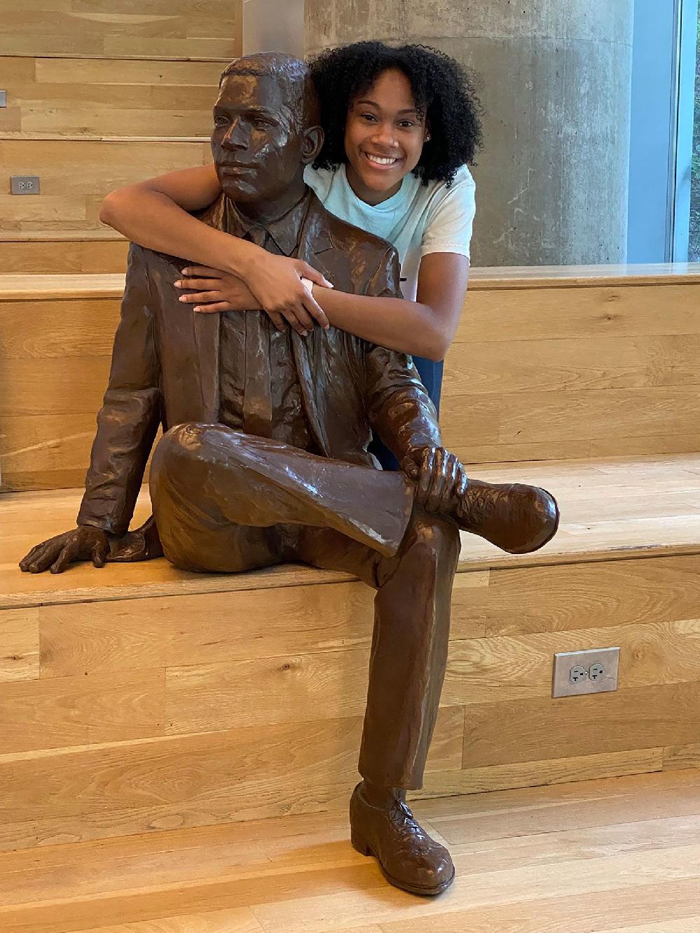 Deanna Yancey embraces statue of her grandfather Ronald Yancey (Courtesy Deanna Yancey via CNN Newsource) 