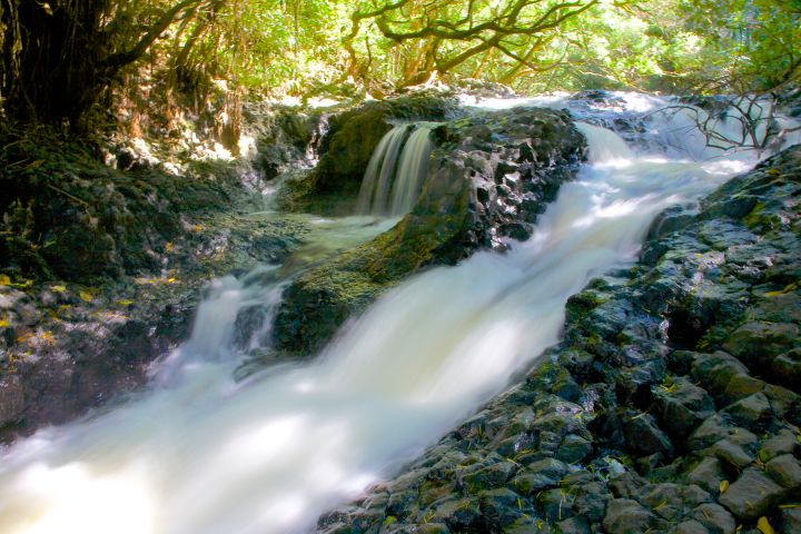 White water moving quickly over rocks at Twin Falls, Hawaii