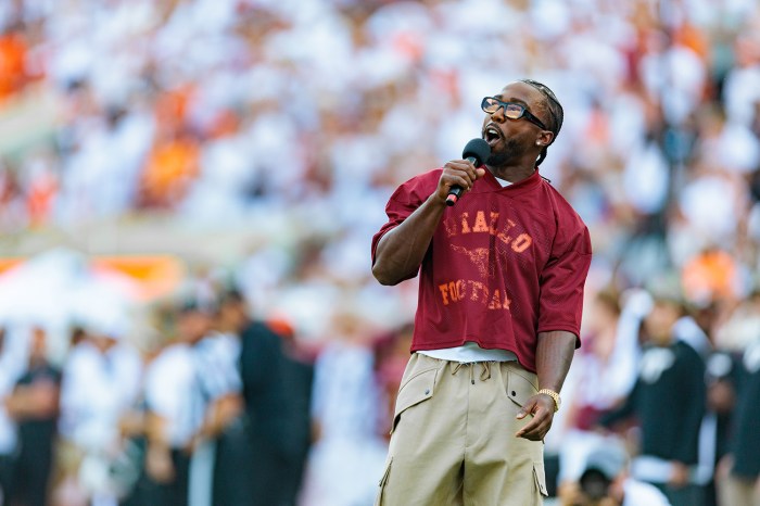 Tyrod Taylor speaks to the crowd at Lane Stadium